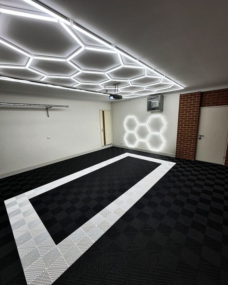 Wide view of the ULTRAGRID Jet Black floor with the Alpine White outline