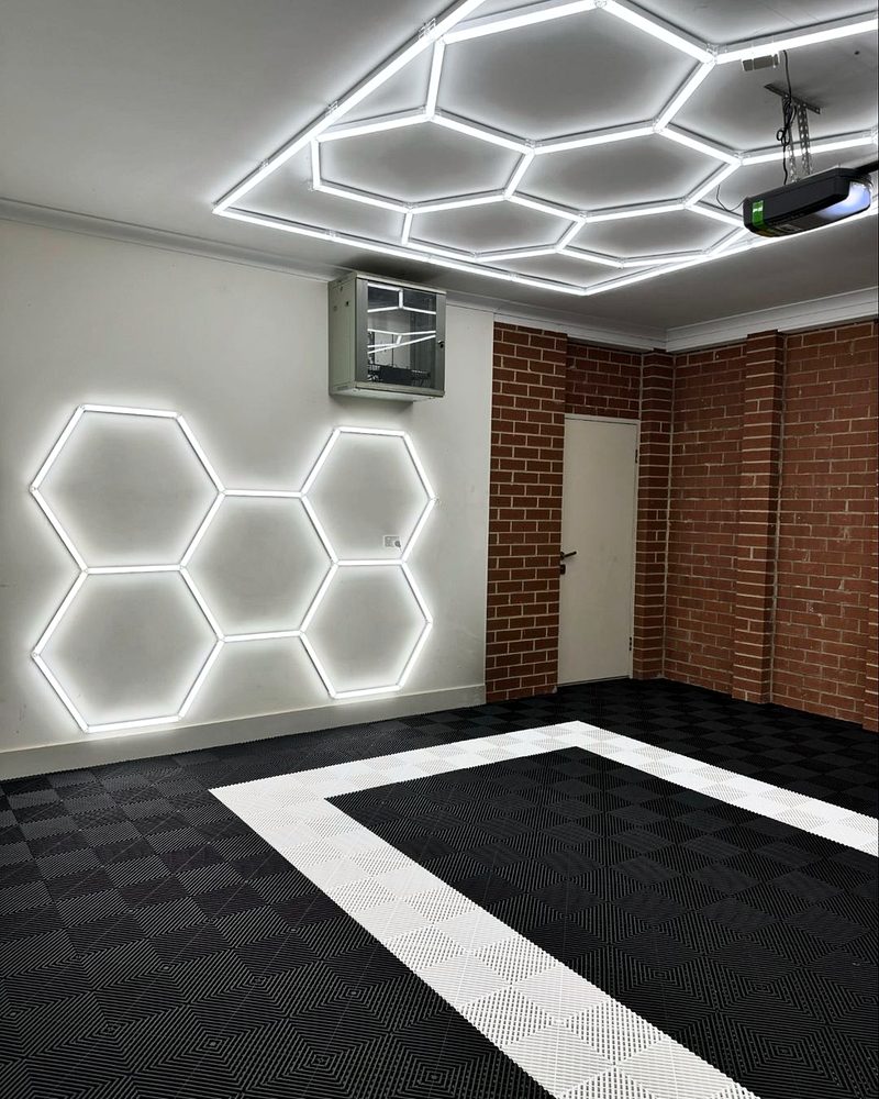 Alpine White outline on the Jet Black ULTRAGRID floor, brick and white walls