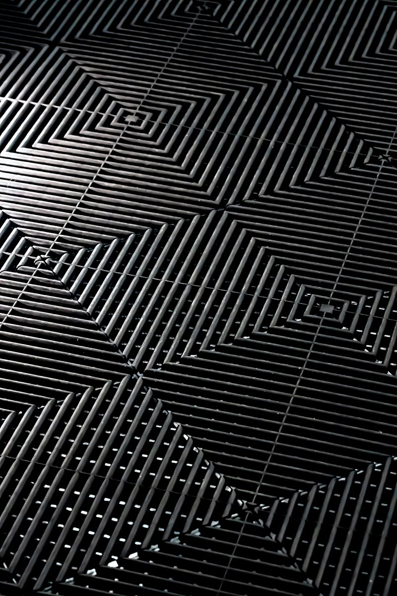 Overhead view of Jet Black ULTRAGRID tiles locked together in the chequer pattern