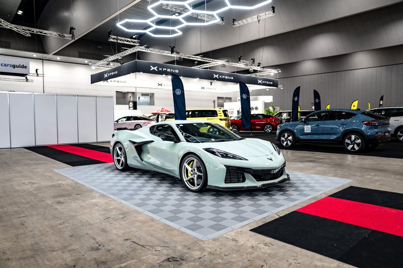 Chevrolet Corvette C8 on ULTRAGRID Silver Grey tiles under ULTRABEAM hexagon lights